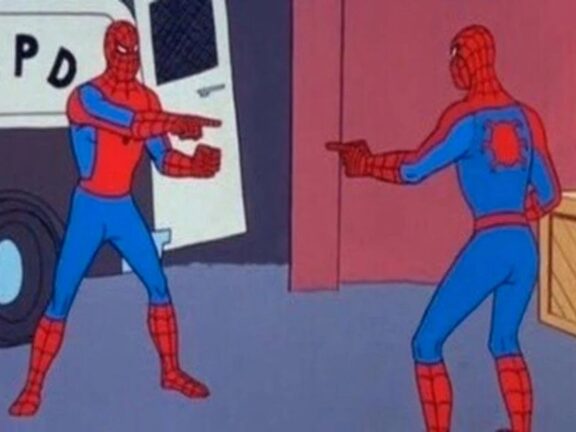 Two Spider Man characters pointing at each other
