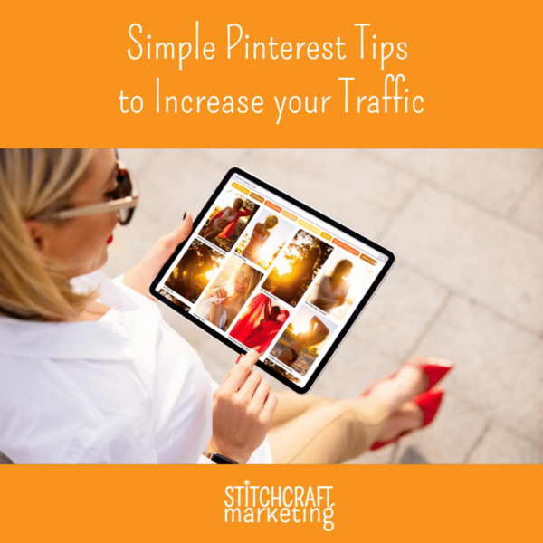 Over the shoulder point of view as a woman browses pinned photos on a table. The blog title "Simple Pinterest Tips to Increase Your Traffic" written above.